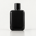 Sleek black luxury perfume bottle front view with cap on