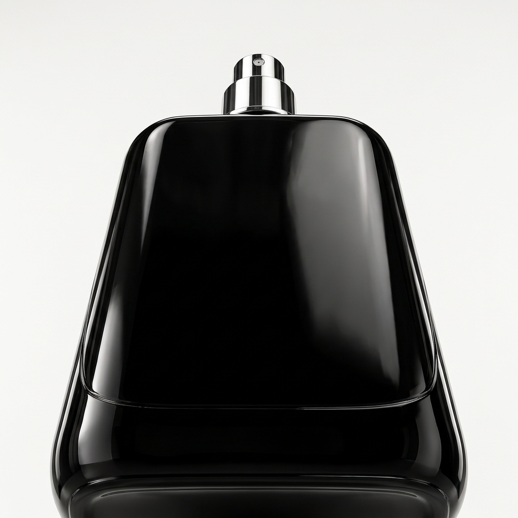 Sleek black luxury perfume bottle low angle hero shot from below